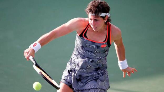 Garbiñe Muguruza y la grancanaria Carla Suárez, a tercera ronda