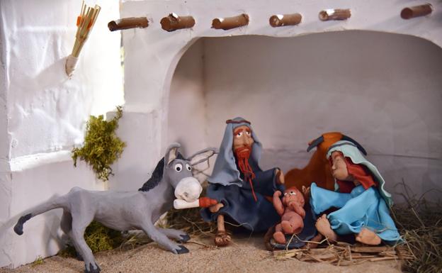 Manitas que modelan Navidad