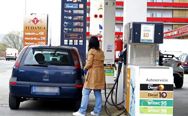 A customer refuels at a gas station. 
