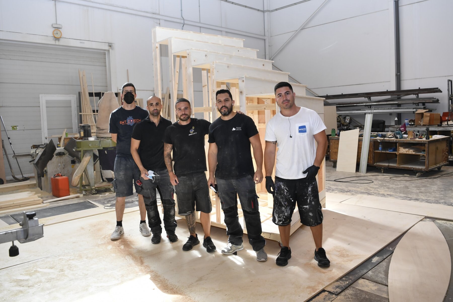   The members of the team that works in the Majoreras building the sets. 